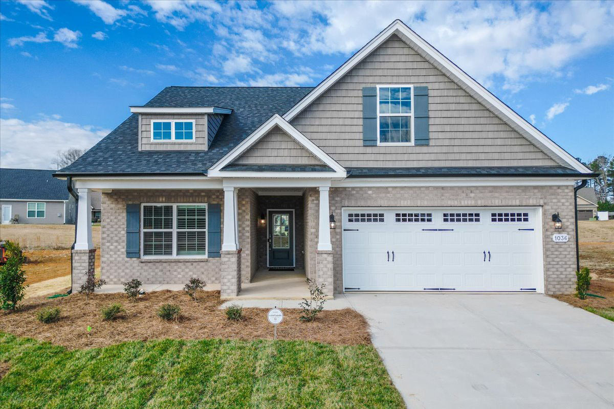 https://assets.windsorhomes.us/img/MG_Lot102_Pinehurst_C_1036_Fairhaven_Dr_exterior_full_front_crop.jpg