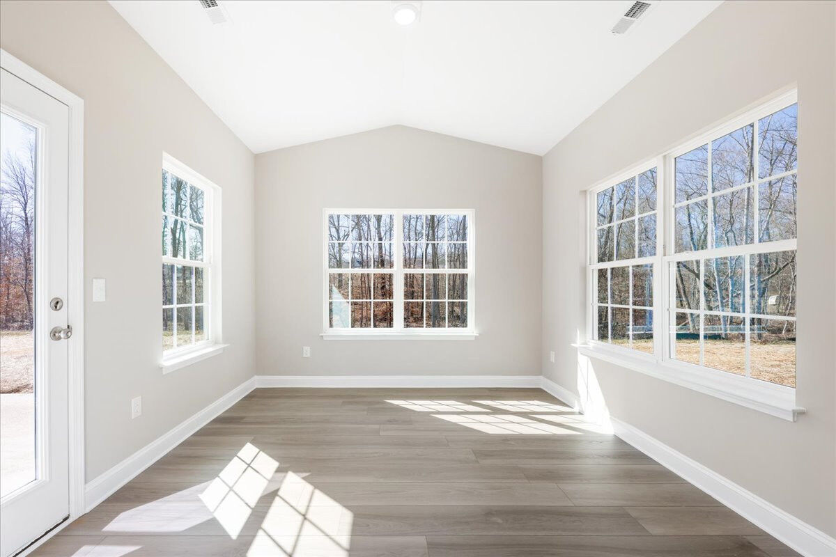 https://assets.windsorhomes.us/img/MVG_lot14_Cary_elvC_1981_Meadowview_Drive_sun_room.jpg